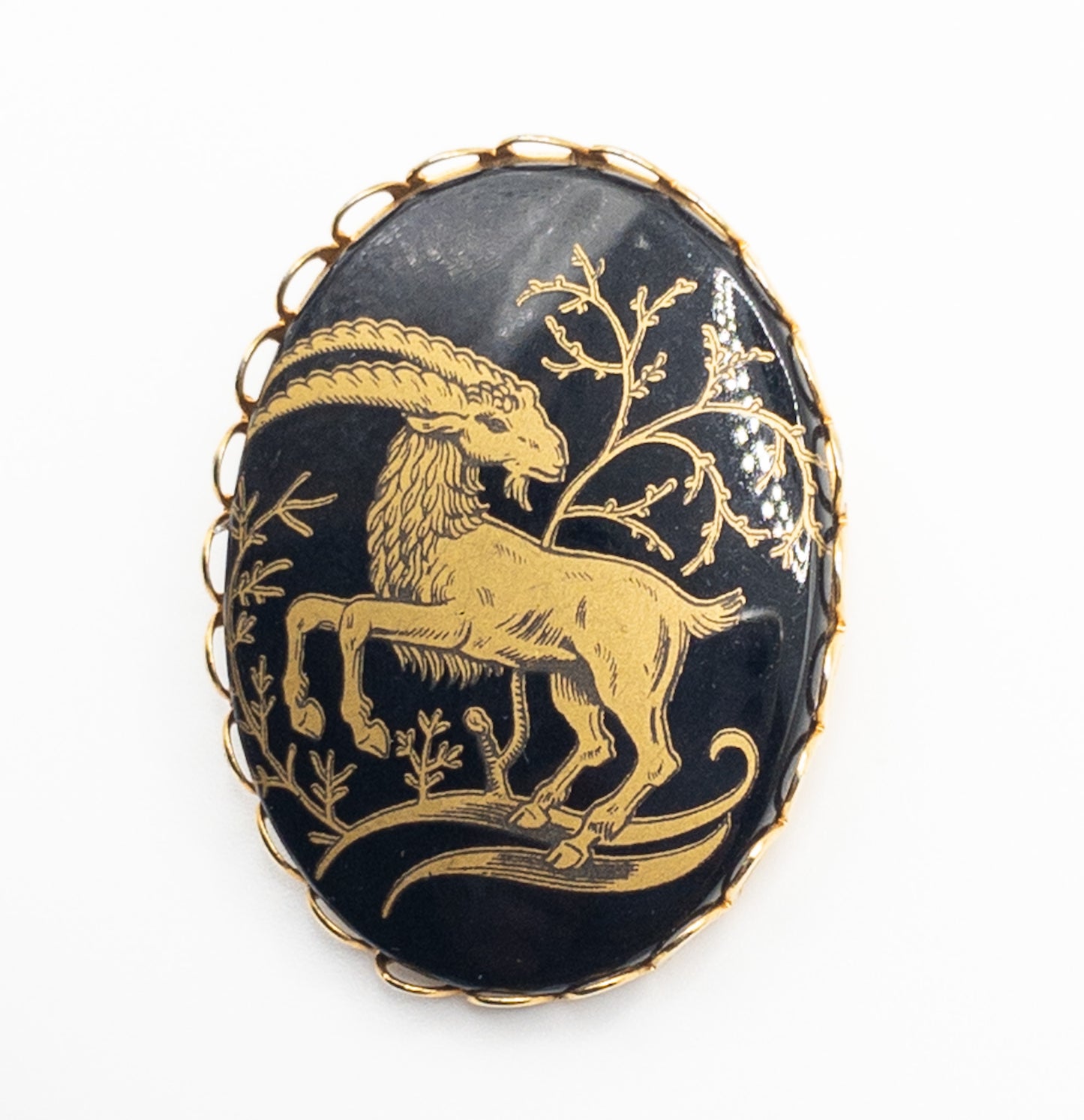 Vintage Porcelain gold and black ibex brooch